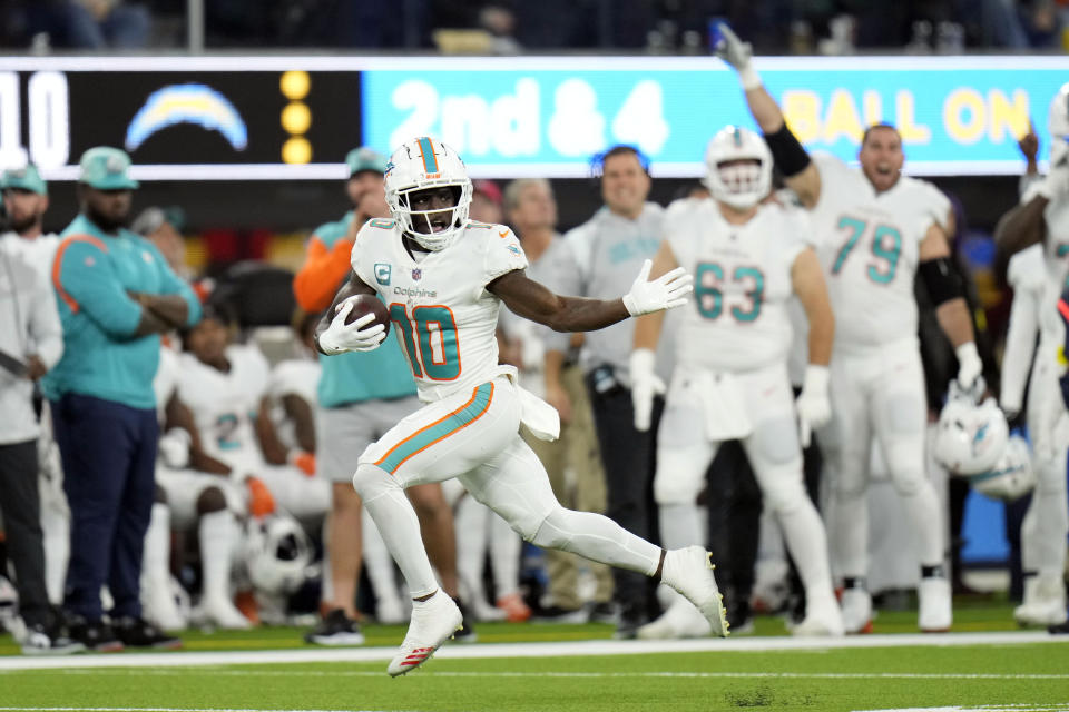 Miami Dolphins wide receiver Tyreek Hill (10) runs for a touchdown after recovering a fumble. (AP Photo/Jae C. Hong)