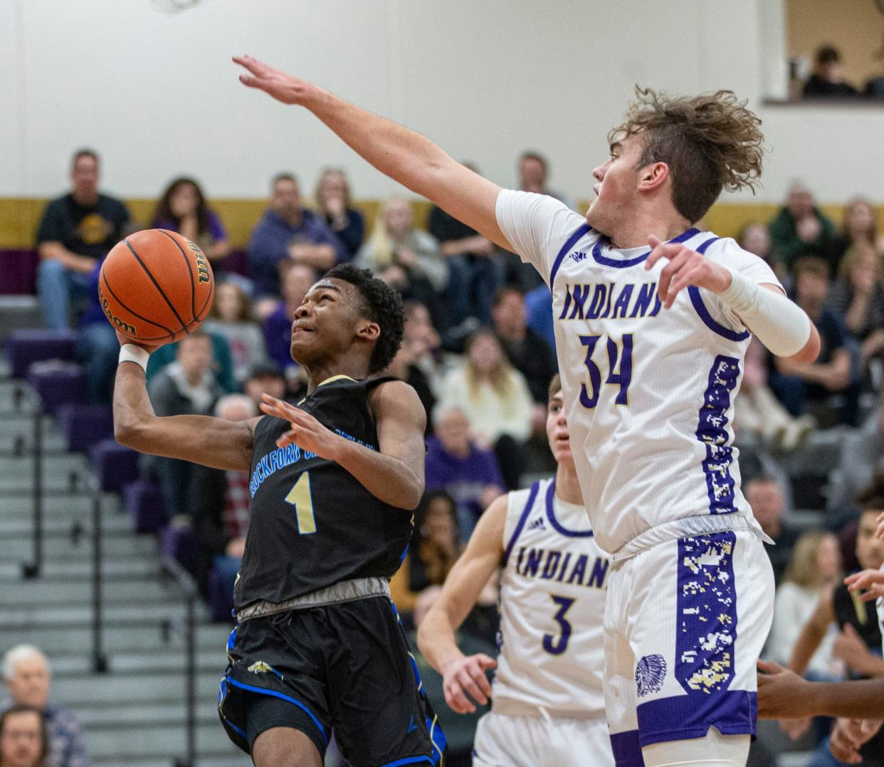 Rockford Christian senior Kevion Cummings (1) shoots around Pecatonica's Korbin Gann (34) in a battle of two state-ranked teams Jan. 9, 2023 at Pecatonica. The two will be teammates April 15 in the Rising Stars Classic, as the area all-stars try to improve to 7-5 against the NIC-10 in the last 12 games.