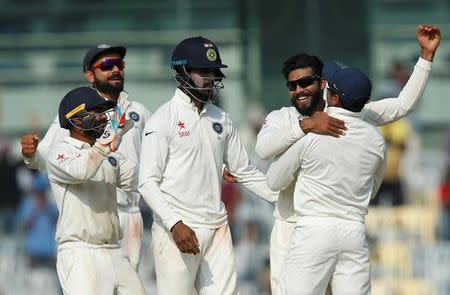 Cricket - India v England - Fifth Test cricket match - M A Chidambaram Stadium, Chennai, India - 20/12/16. India's Ravindra Jadeja (2nd R) celebrates with team mates the dismissal of England's Ben Stokes. REUTERS/Danish Siddiqui