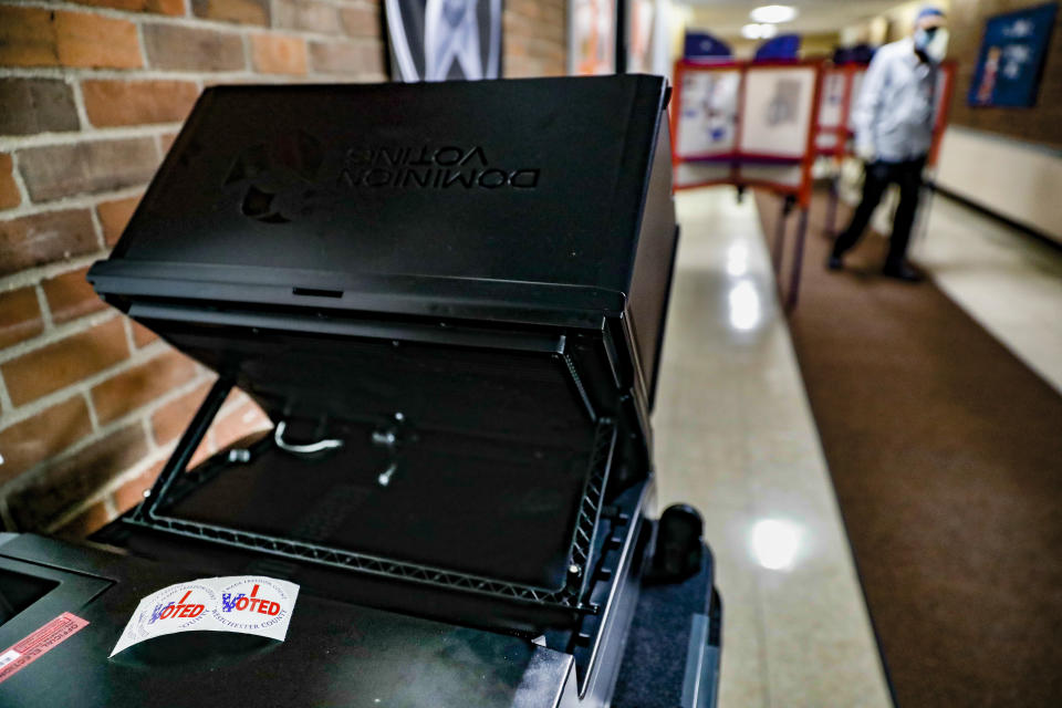 Stickers reading "I Voted" rest on a voting machine set up inside a polling station for New York's primary election at Yonkers Middle/High School, Tuesday, June 23, 2020, in Yonkers, N.Y. (AP Photo/John Minchillo)