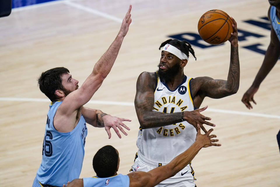 Indiana Pacers forward JaKarr Sampson (14) shoots over Memphis Grizzlies guard John Konchar (46) during the second half of an NBA basketball game in Indianapolis, Tuesday, Feb. 2, 2021. (AP Photo/Michael Conroy)