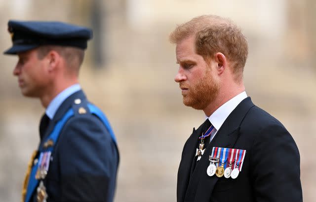 Justin Setterfield/Getty Prince William and Prince Harry walk behind Queen Elizabeth's coffin during her funeral in September 2022.