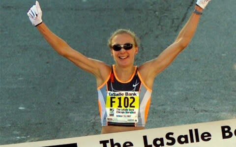 Paula Radcliffe reacts as she crosses the finish line in the 25th Chicago Marathon, October 13, 2002 - Credit: REUTERS