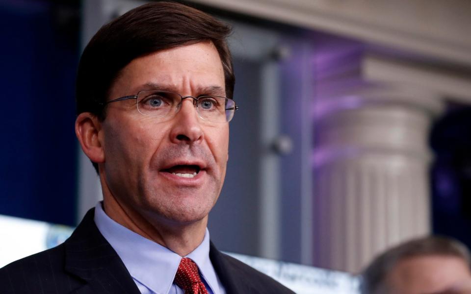 Mark Esper, the defence secretary, contradicted Mr Trump in public - AP