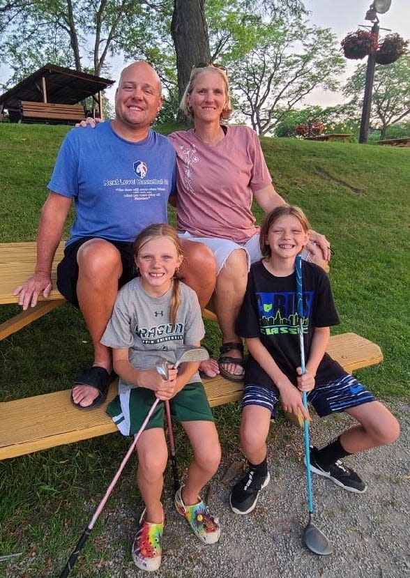 David and Amy Sheldon with their children, Paige, left, and Caroline.