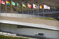 Maxim Andrianov, Aleksei Pushkarev, Vasiliy Kondratenko, and Vladislav Zharovtsev of Russia compete in the four-man bobsleigh during an IBSF Sanctioned Race, a test event for the 2022 Winter Olympics, at the Yanqing National Sliding Center in Beijing, Tuesday, Oct. 26, 2021. (AP Photo/Mark Schiefelbein)