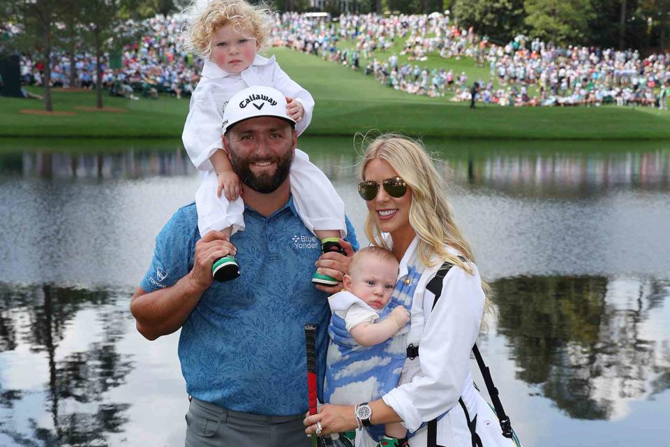 <p>Andrew Redington/Getty</p>  Jon Rahm, Kelley Cahill, and their kids Eneko and Kepa during the Par 3 contest prior to the 2023 Masters Tournament on April 05, 2023 in Augusta, Georgia. 