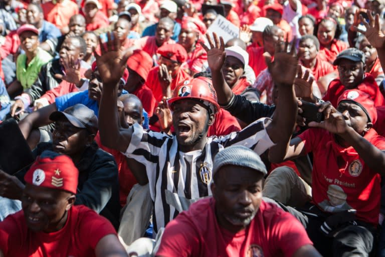 Zimbabwe opposition party supporters shout anti-government slogans during a demonstration in the central city of Gweru, on August 13, 2016