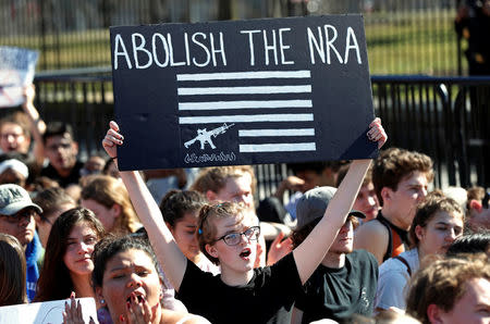 Students who walked out of their Montgomery County, Maryland, schools protest against gun violence in front of the White House in Washington, U.S., February 21, 2018. REUTERS/Kevin Lamarque