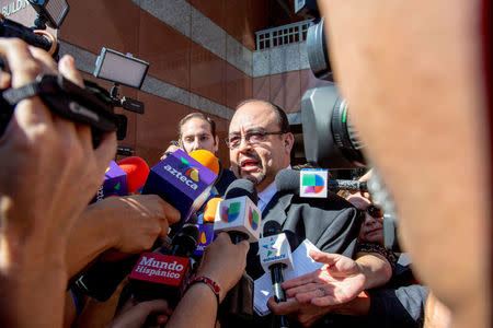 Mexican singer Luis Miguel's lawyer, Kris Demirjian, (C), ignores questions from various news outlets outside the Edward R. Roybal Federal Building in Los Angeles, California, U.S. May 2, 2017. REUTERS/Kyle Grillot