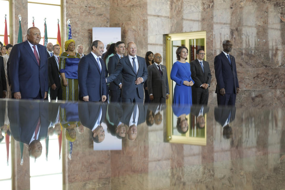 German Chancellor Olaf Scholz, center right, and Egypt's President Abdel Fattah Al-Sisi, center left, pose with the Foreign Ministers of Egypt Sameh Shoukry, left, and Germany Annalena Baerbock, third from right, and other participants for a group photo during the Petersberg Climate Dialogue conference at the Foreign Ministry in Berlin, Germany, Monday, July 18, 2022. (AP Photo/Markus Schreiber)