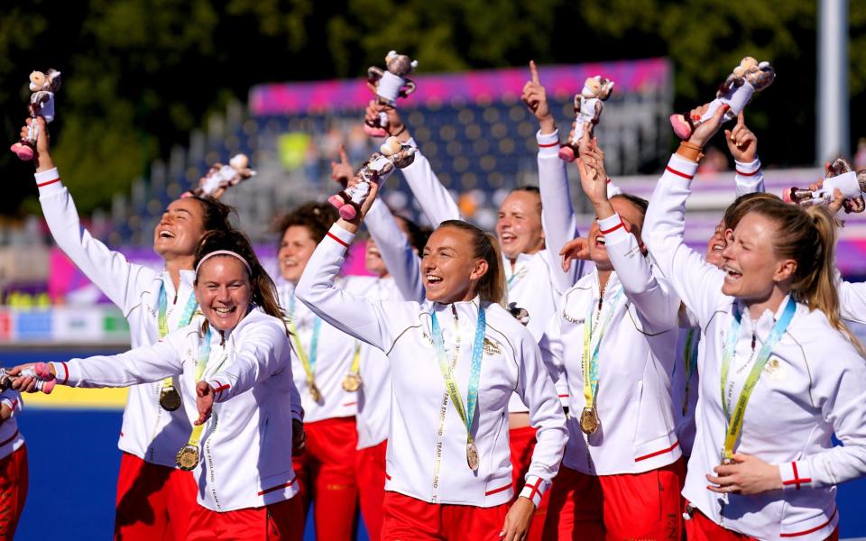 England's Hannah Martin (front, centre) celebrates with her team-mates after receiving their gold medals for the Women's Gold Medal Hockey match against Australia at the University of Birmingham Hockey and Squash Centre on day ten of the 2022 Commonwealth Games in Birmingham. Picture date: Sunday August 7, 2022 - PA