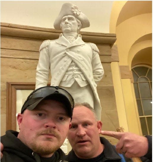 The Justice Department released a photo of Jacob Fracker and Thomas Robertson, two off-duty police officers with the city of Rocky Mount, Va., inside the U.S. Capitol during the Jan. 6, 2021, riot.