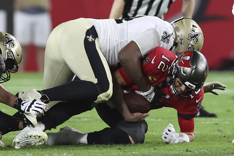 New Orleans Saints defensive end Cameron Jordan (94) sacks Tampa Bay Buccaneers quarterback Tom Brady (12) during the first half of an NFL football game Sunday, Dec. 19, 2021, in Tampa, Fla. (AP Photo/Mark LoMoglio)