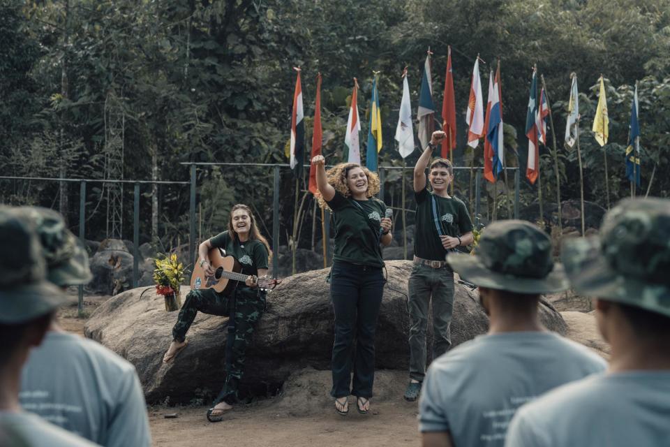 The Eubanks’ children — from left, Sahale, Suuzanne and Pete — perform for the volunteers to lighten the mood.