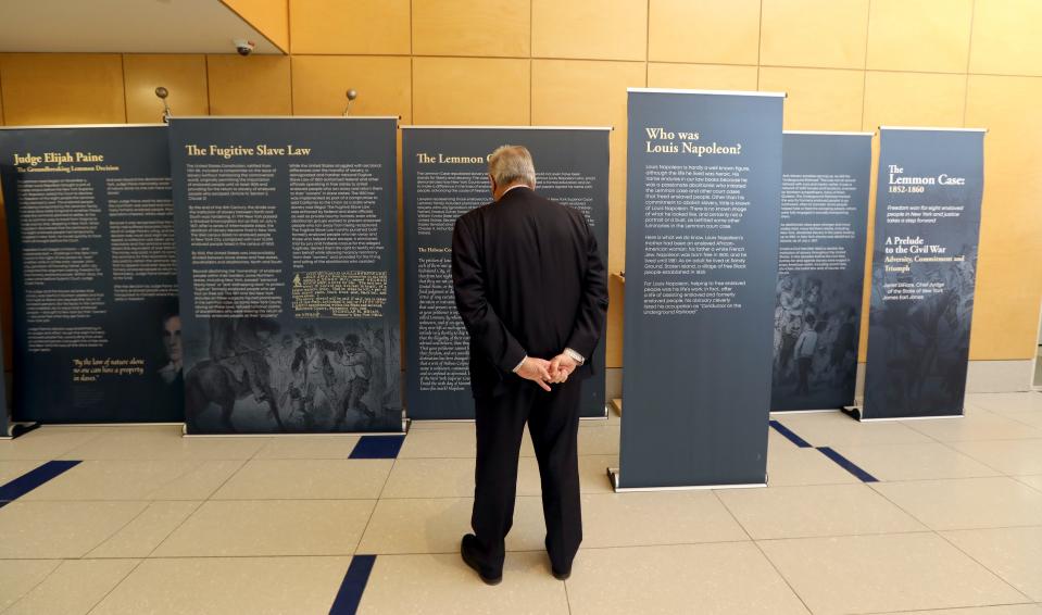 Rockland County Supreme Court Justice Robert Berliner looks at a traveling exhibit about the Lemmon Case at the Rockland County Courthouse in New City Jan. 18, 2022. The 1850s case involved a southern man who brought his slaves to New York, where they were declared free.