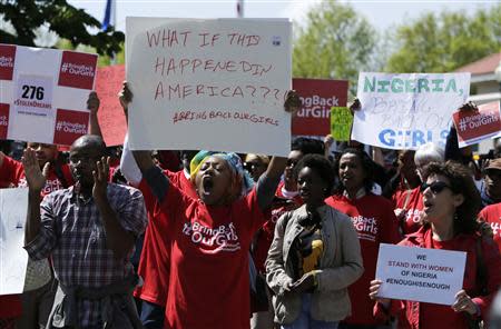 Protesters march in support of the girls kidnapped by members of Boko Haram in front of the Nigerian Embassy in Washington May 6, 2014. REUTERS/Gary Cameron