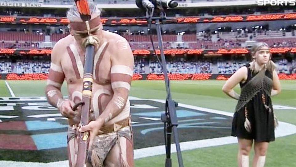 Karl Telfer, pictured here playing the didgeridoo at the Adelaide Oval.