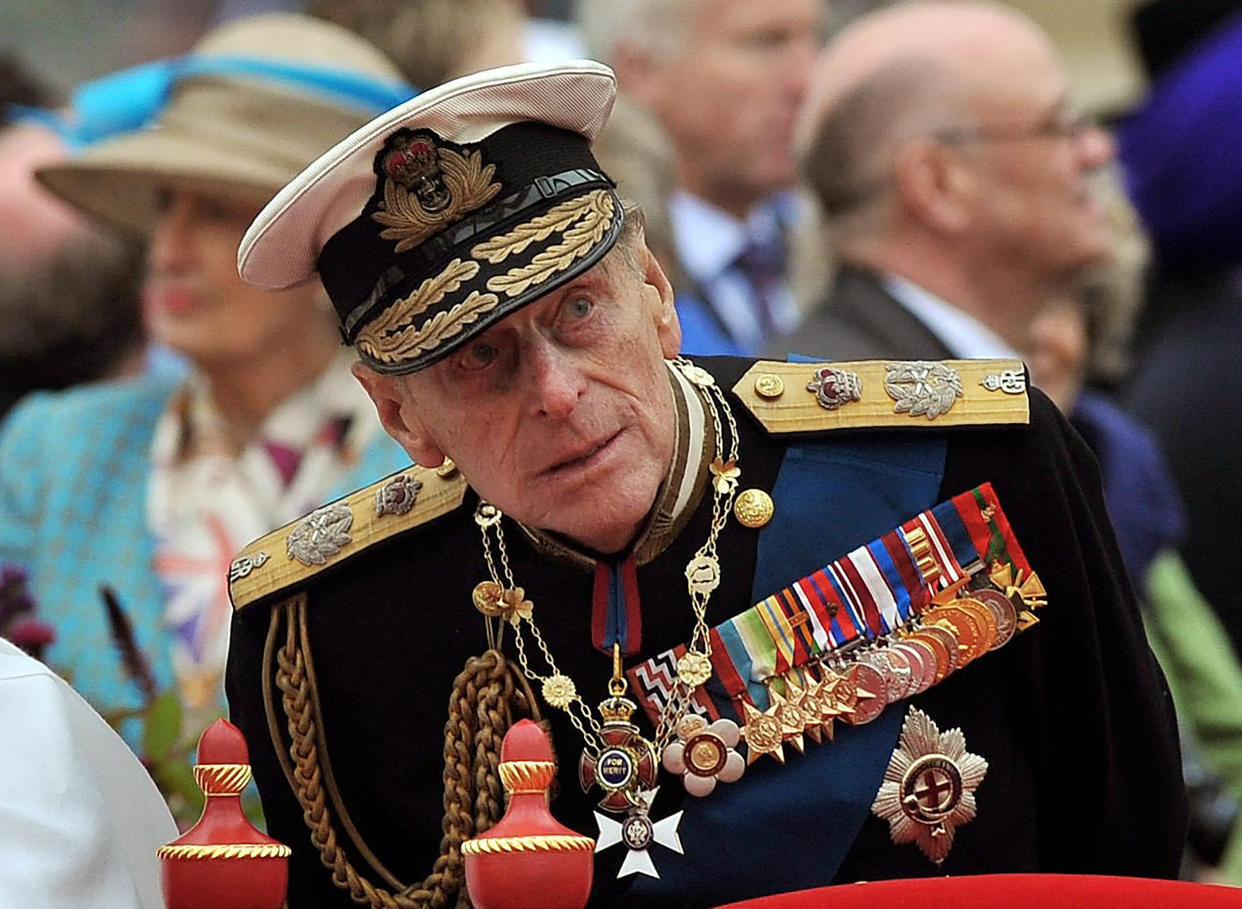 FILE - A Sunday June 3, 2012 photo from files showing Prince Philip watching the proceedings from the royal barge during the Diamond Jubilee Pageant on the River Thames in London. Buckingham Palace said Thursday March 4, 2021, that Prince Philip has undergone a successful procedure for a pre-existing heart condition, and will remain in hospital 