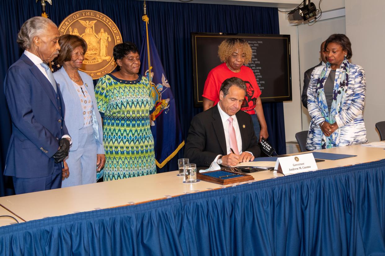 From left, Al Sharpton, Hazel Dukes, Valerie Bell, Gwen Carr, Carl Heastie and Andrea Stewart-Cousins watch as Gov. Cuomo signs into law the repeal of 50-a in Manhattan on Friday, June 12, 2020. 