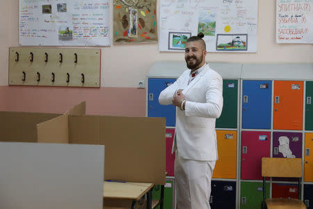 Student and presidential candidate Luka Maksimovic, also known as "Beli", smiles before casting his vote at a polling station during elections in Mladenovac, Serbia April 2, 2017. REUTERS/Marko Djurica