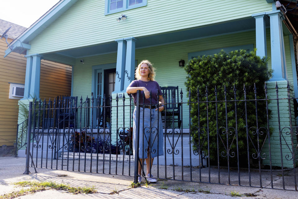 Tulane University graduate student Robin S. Smith poses for a portrait in front of the Craftsman-style house in New Orleans on Sept. 29, 2023. Smith led the effort to get the home, which belonged to the family of civil rights activist Oretha Castle Haley, on the National Register of Historic Places. (Photos by Sabree Hill/Tulane University)