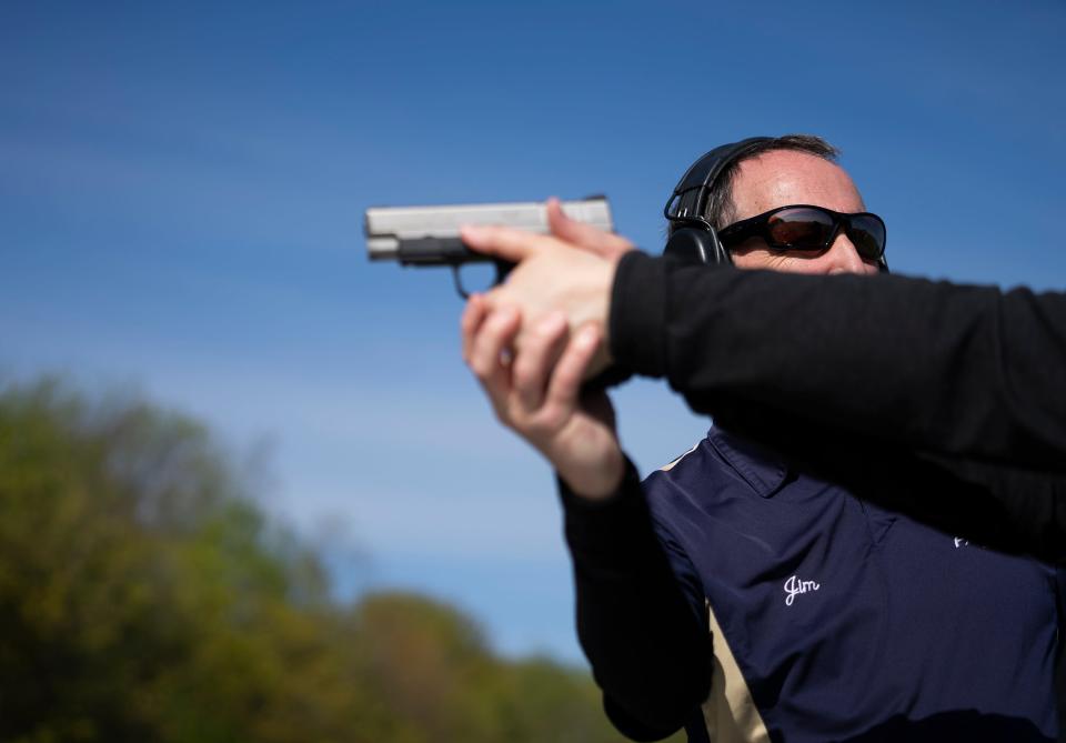 May 6, 2023; Medina, Ohio, USA; Jim Irvine gives instruction during the range instruction part of a concealed carry course. Trainees are required three hours of instruction on the range.  Mandatory Credit: Brooke LaValley/Columbus Dispatch