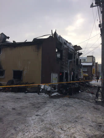 The charred exterior of a senior persons welfare facility is pictured in Sapporo, Hokkaido, Japan Februray 1, 2018, in this picture obtained from social media. @COMINVOICE/via REUTERS