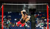 Germany's Philipp Boy slips off the bar as the competes in the qualification round on the horizontal bar during the London 2012 Olympic Games Artistic Gymnastics competition, London, Britain, 28 July 2012. EPA/Rolf Vennenbernd