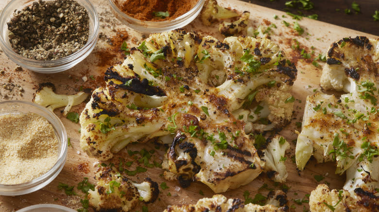 Roasted cauliflower next to seasonings 