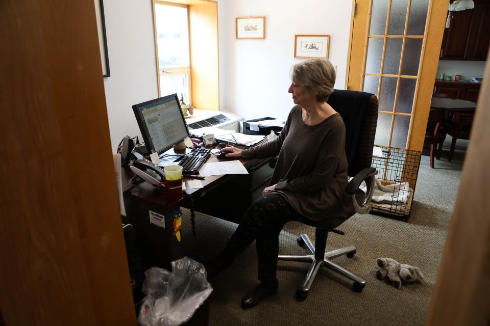 Lucinda Ross, executive director of St. Micheal's School and Nursery, sits in her office, in 2020.