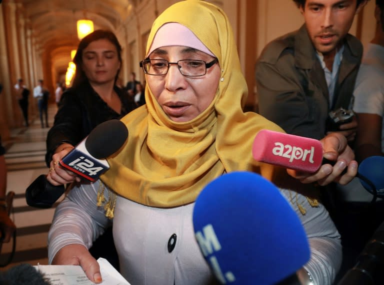 Zoulikha Aziri, mother of Mohamed Merah, speaks to journalists on October 18, 2017 as she arrives at the Paris courthouse to testify during the trial of Abdelkader Merah who stands accused of complicity in the series of shootings committed by his jihadist brother in Toulouse and Montauban in 2012