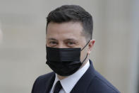 Ukrainian President Volodymyr Zelenskyy arrives for a working lunch with French President Emmanuel Macron at the Elysee palace in Paris, Friday, April 16, 2021. Ukrainian President Volodymyr Zelenskyy is holding talks with French President Emmanuel Macron and German Chancellor Angela Merkel amid growing tensions with Russia, which has deployed troops at the border with the country. (AP Photo/Lewis Joly)