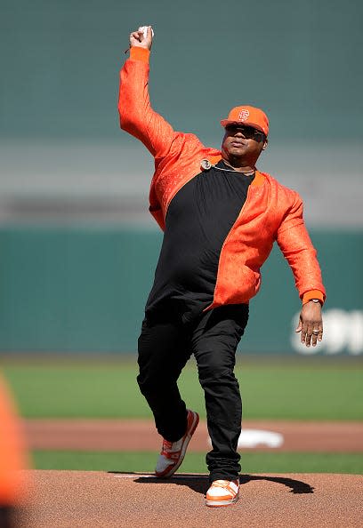 Earl Tywone Stevens Sr. - better known as the rapper E-40 - throws out the ceremonial first pitch prior to the start of the Cincinnati Reds San Francisco Giants game at Oracle Park on June 25, 2022 in San Francisco, California.