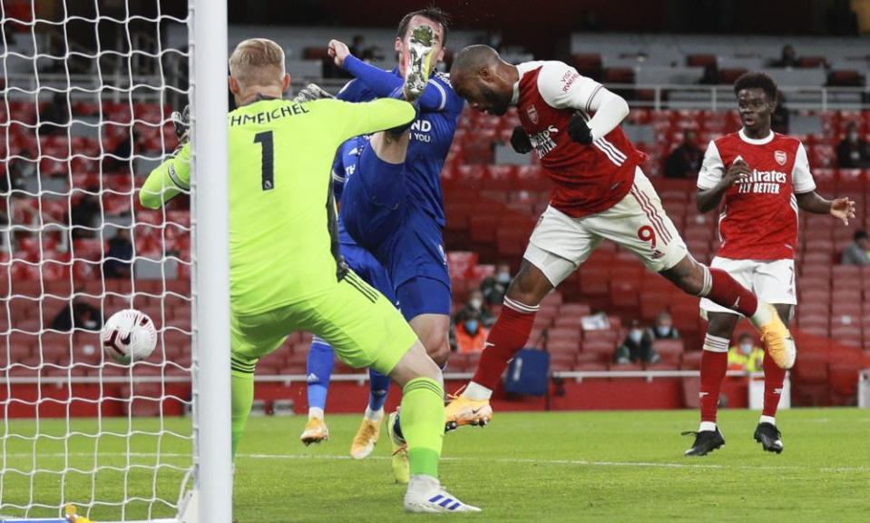 Arsenal’s Alexandre Lacazette (right) heads wide.