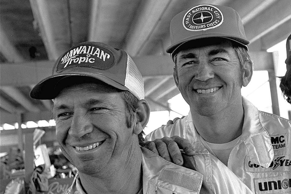 FILE - Donnie Allison, left, and Bobby Allison smile in Talladega, Ala., in this April 29, 1977, file photo. Donnie Allison, will join his “Alabama Gang” brother, Bobby, in the NASCAR Hall of Fame ceremonies Friday night, Jan. 19, 2024. (AP Photo/Joe Holloway, Jr., File)