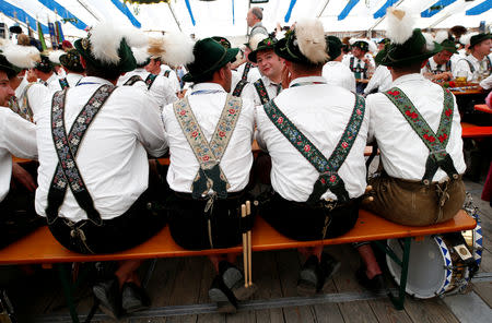 People in traditional costumes take part at the 73rd "Gaufest" in Murnau, Germany July 8, 2018. REUTERS/Michaela Rehle
