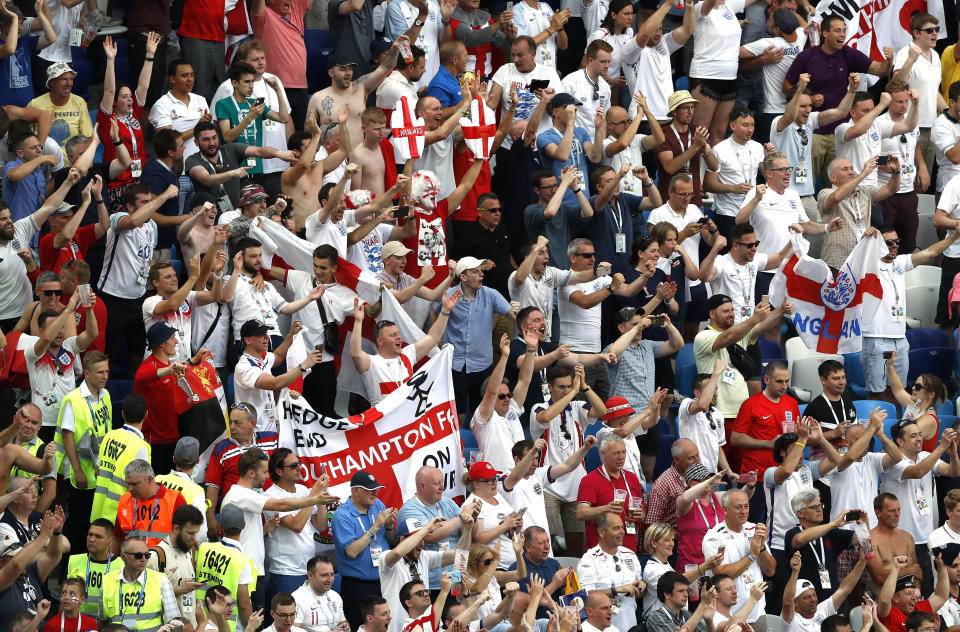 England fans in the stadium cheer the side on at the end of the game