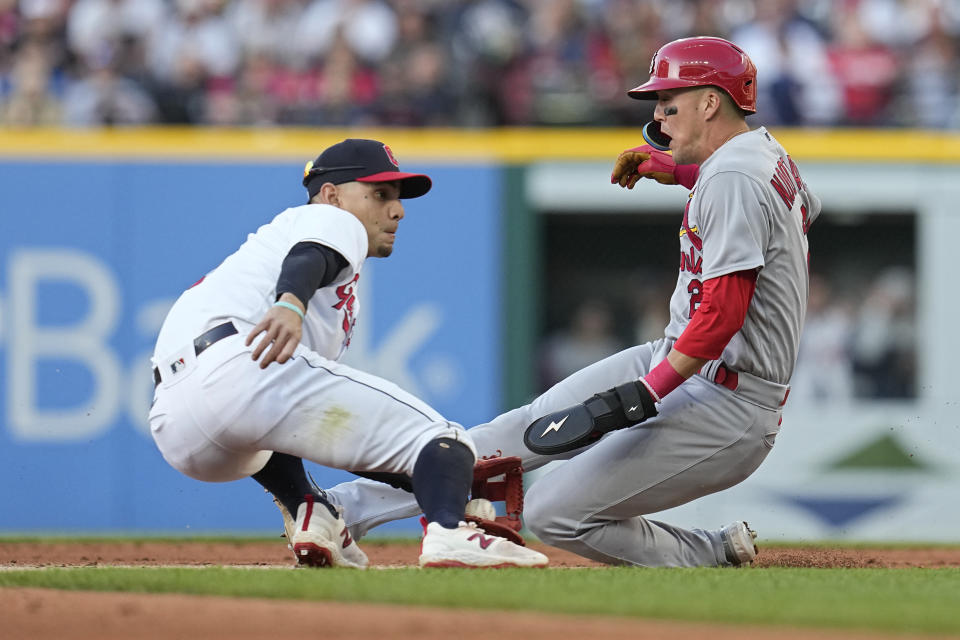 Cleveland Guardians second baseman Andres Gimenez, left, tags out St. Louis Cardinals' Lars Nootbaar on an attempted steal of second during the third inning of a baseball game Friday, May 26, 2023, in Cleveland. (AP Photo/Sue Ogrocki)