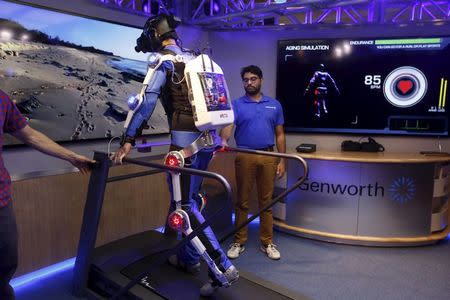 Ugo Dumont, a volunteer for the Genworth R70i Aging Experience, walks on a tread mill during a demonstration at the Liberty Science Center in Jersey City, New Jersey, April 5, 2016. REUTERS/Shannon Stapleton