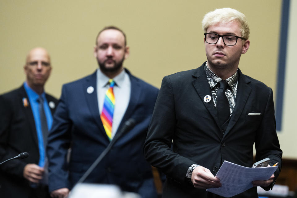 Michael Anderson, right, and James Slaugh, survivors of the Club Q shooting in Colorado Springs, and Matthew Haynes, a founding owner of the club, arrive for the House Oversight and Reform Committee hearing titled 