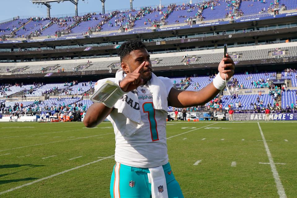 Dolphins quarterback Tua Tagovailoa takes a selfie after leading Miami's 42-38 comeback win over the Ravens last season.