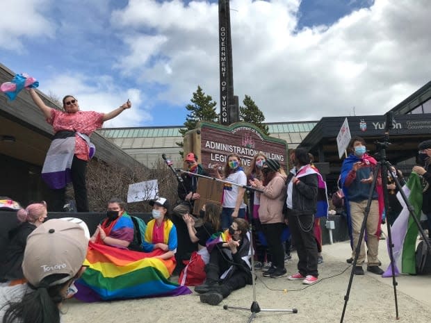 Grey Capot-Blanc of the group Northern Voices Rising reacts to the crowd chanting today in Whitehorse, 'Hey, hey, this is not OK!