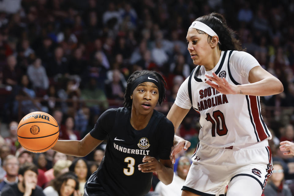 Vanderbilt guard Jordyn Cambridge (3) drives against South Carolina center Kamilla Cardoso (10) during the second half of an NCAA college basketball game in Columbia, S.C., Sunday, Jan. 28, 2024. (AP Photo/Nell Redmond)