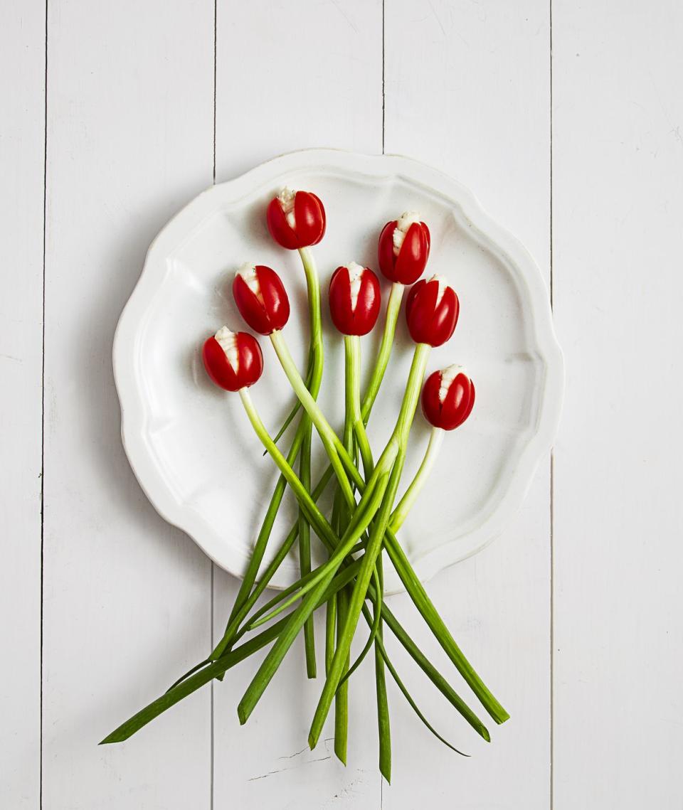 <p>These pretty appetizers practically spring into bloom, and they're so easy to assemble. Just don't forget to tell your guests about the hidden toothpick!</p><p><a href="https://www.goodhousekeeping.com/food-recipes/dessert/g3303/how-to-make-your-food-look-like-flowers/?slide=1" rel="nofollow noopener" target="_blank" data-ylk="slk:Get the recipe for Tomato Tulips »;elm:context_link;itc:0;sec:content-canvas" class="link "><em>Get the recipe for Tomato Tulips »</em></a><br></p>