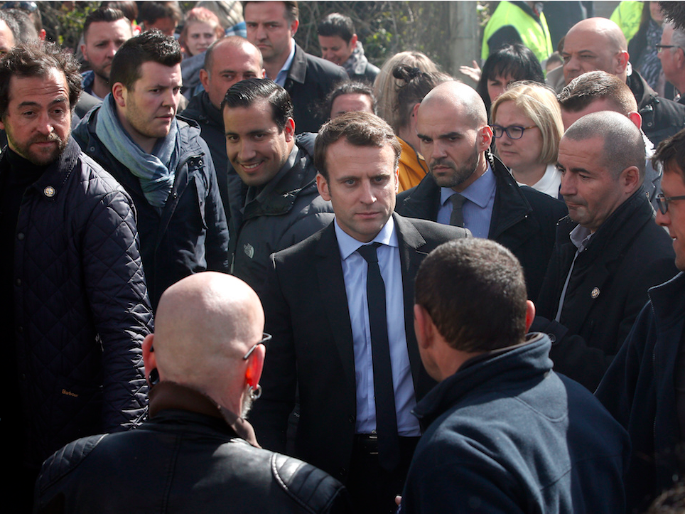 French centrist presidential election candidate Emmanuel Macron, center, visits the Whirlpool home appliance factory, Wednesday April 26, 2017 in Amiens, northern France. Far-right French presidential candidate Marine Le Pen has earlier upstaged Macron as she made a surprise campaign stop to the plant.
