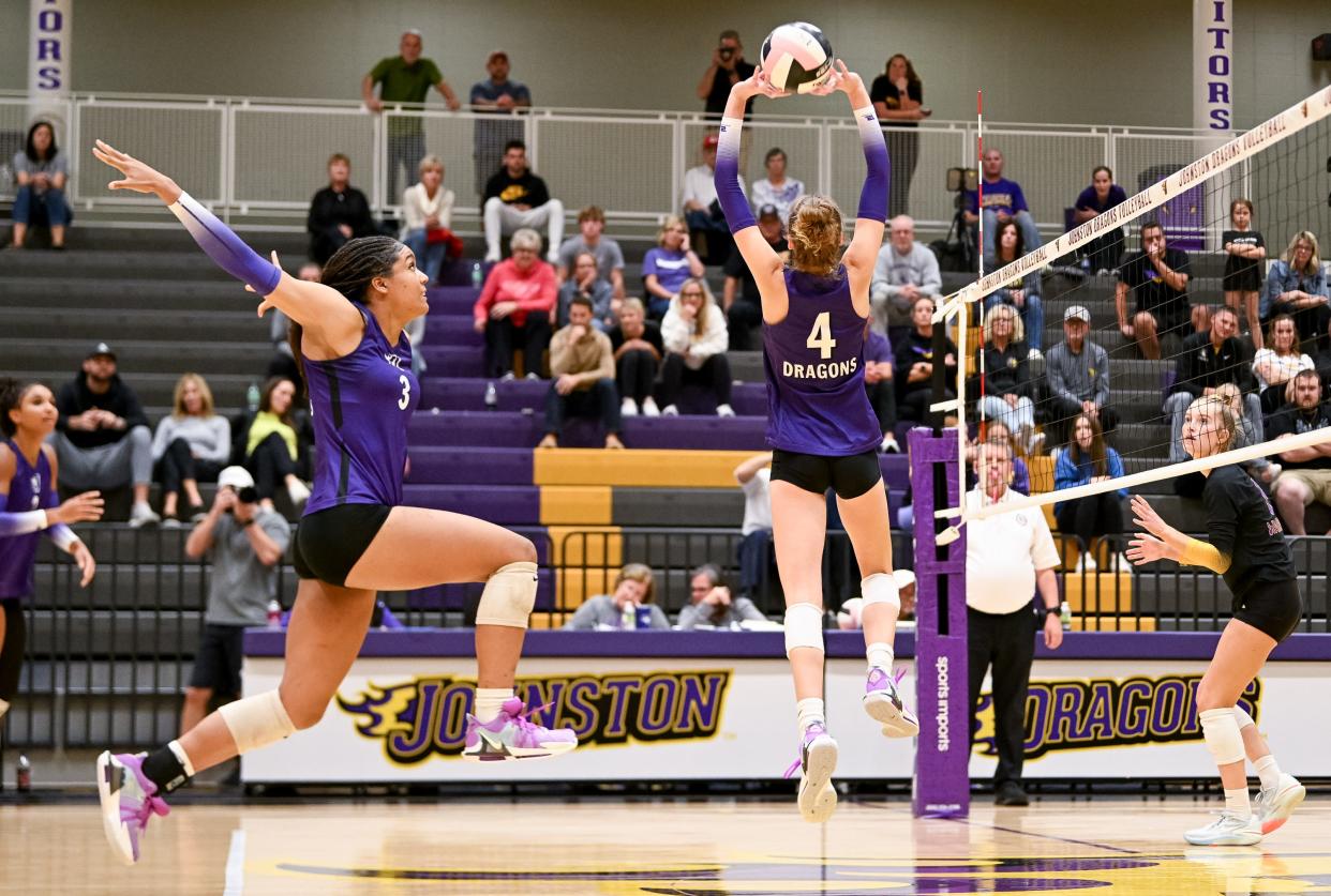 Johnston's Jadeyn Pundt (4) sets up Jazmine Bell (3) during Tuesday's Class 5A regional final volleyball match against Waukee. Johnston won 3-0 at home to advance to the state tournament in Coralville, which begins Oct. 30.