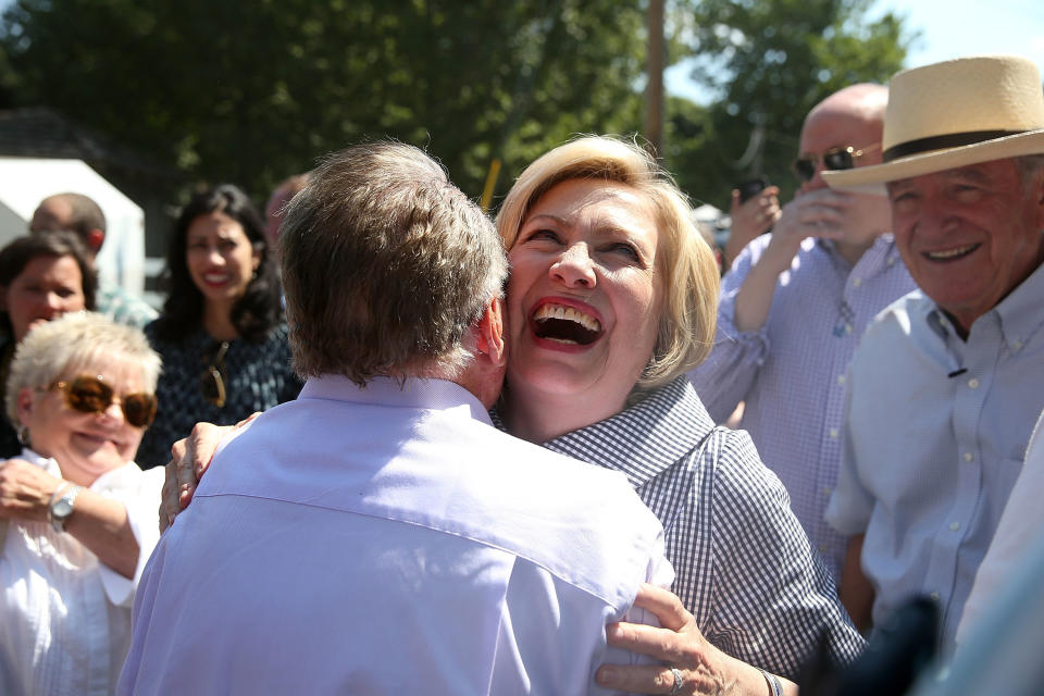 Hillary&nbsp;Clinton hugs a friend while touring the Iowa State Fair.