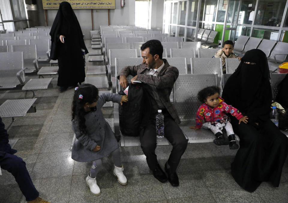 Yemeni people wait in departure lounge at Sanaa International airport, Yemen, Monday, Feb. 3, 2020. A United Nations medical relief flight carrying patients from Yemen's rebel-held capital took off Monday, the first such aid flight in over three years. (AP Photo/Hani Mohammed)