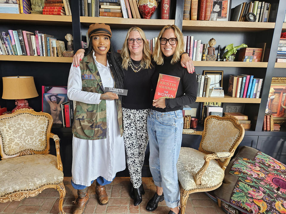 Jeannine A. Cook, author Kristin Hannah and Maria Bello pose at Bello's home during Maria's Literary Salon, featuring a reading of Hannah's book The Women on April 14, 2024.